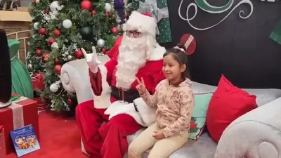 Santa greets hearing-impaired children with sign language at holiday event in Dolphin Mall