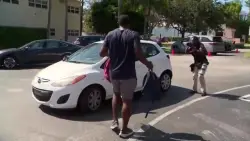 Former Dolphins players hand out hundreds of backpacks to military families at United Way of Broward giveaway