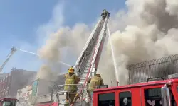 Nearly 100 firefighters battle large fire burning at downtown Los Angeles commercial building