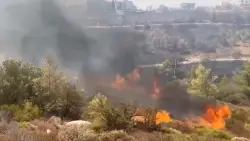 Wildfire burns through northern suburb of Greece’s capital Athens and residents are told to evacuate