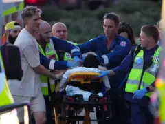 Father and son gunmen kill at least 15 people in attack on Hanukkah event at Sydney’s Bondi Beach