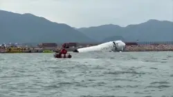 A cargo aircraft skids off a Hong Kong runway into the sea, killing 2 airport workers