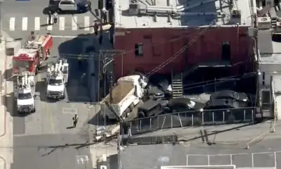 Dump truck crashes into Whisky a Go Go, knocks out power, authorities say